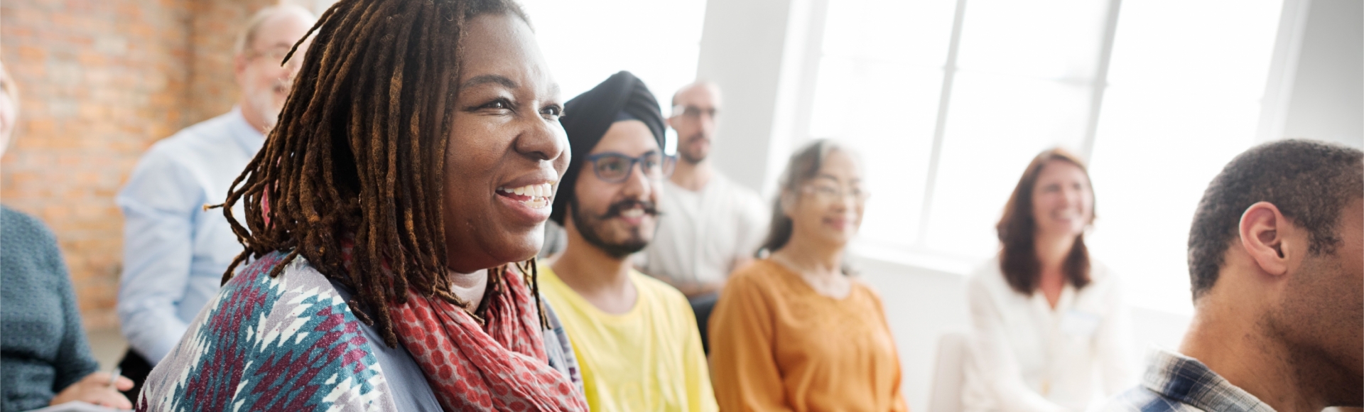 woman smiling in group of people